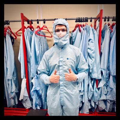 Bryn on site at Plessey as part of the phone system installation process. He is wearing PPE and has his thumbs up.