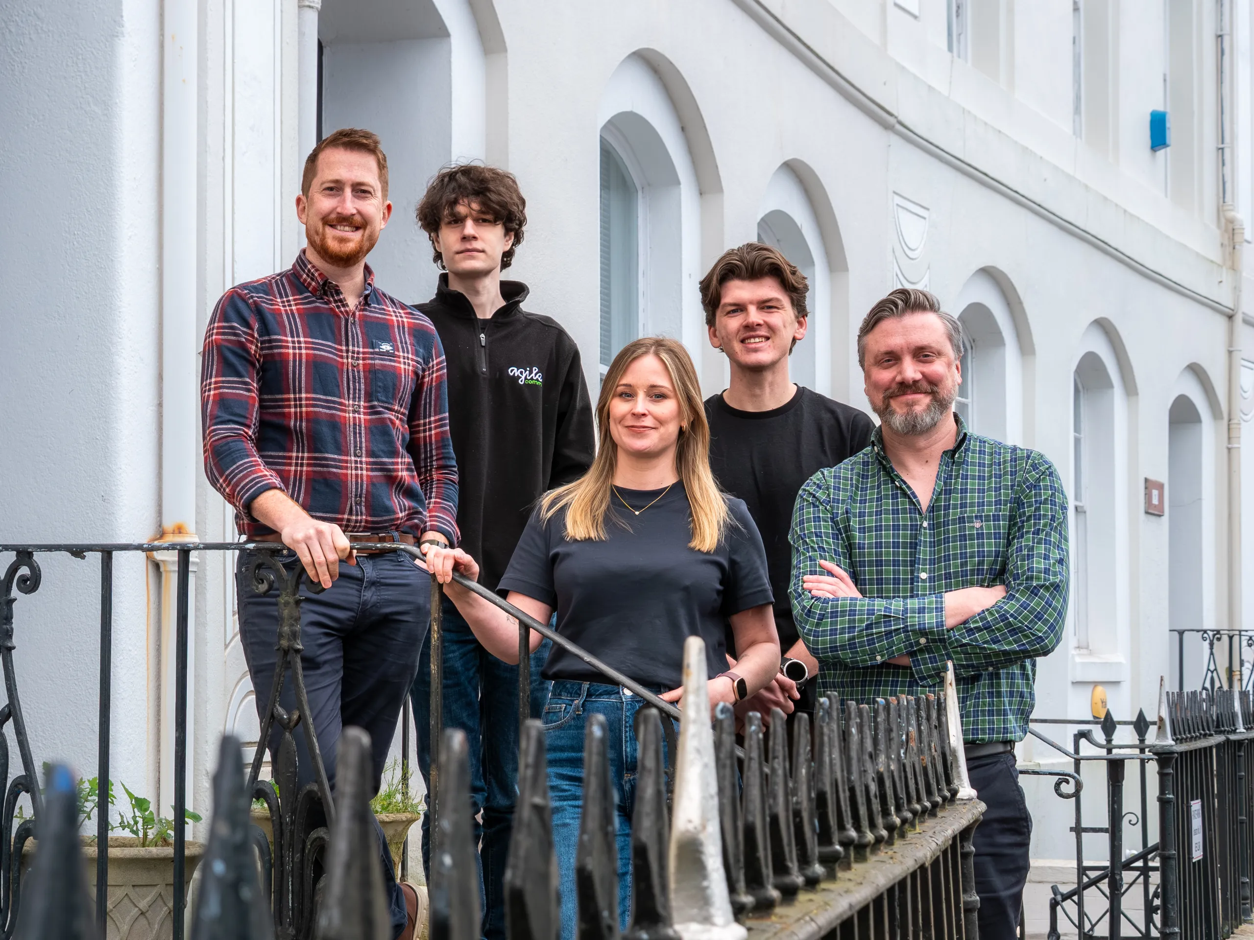 Agile team picture outside of their office in Plymouth